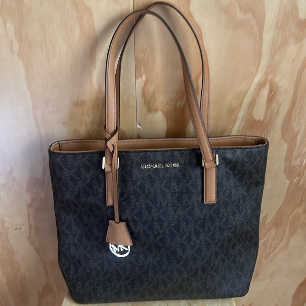 Micheal Kors signature bag in brown and tan. Like new!
